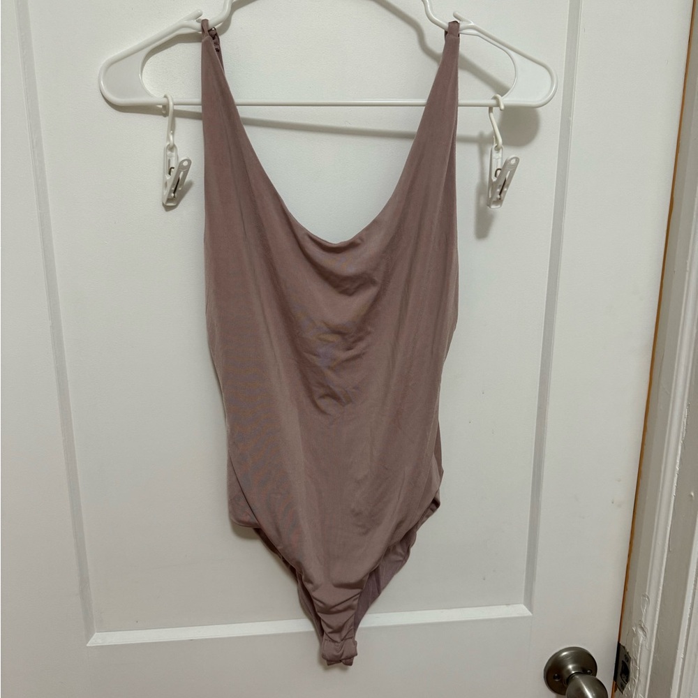 Mauve spandex body suit
